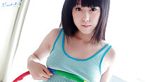 Pressing hula hoop to her small breasts