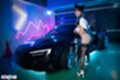 Ria kurumi standing beside car wearing black stockings in high heels