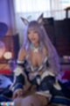 On her knees wearing bunny ears
