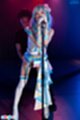 Ria kurumi singing at microphone man behind her