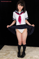 Araki mai raising hem of her kogal uniform skirt wearing socks and shoes.jpg