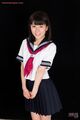 Araki mai with hands clasped wearing uniform