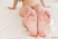 Legs stretched out bare feet