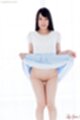 Raising hem of dress showing her shaved pussy