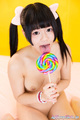 Licking lollipop long hair in pigtails