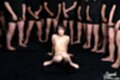 Seated nude knees raised bare feet