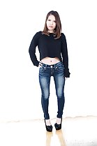 Momoi Momo with hand on hip wearing jeans in high heels